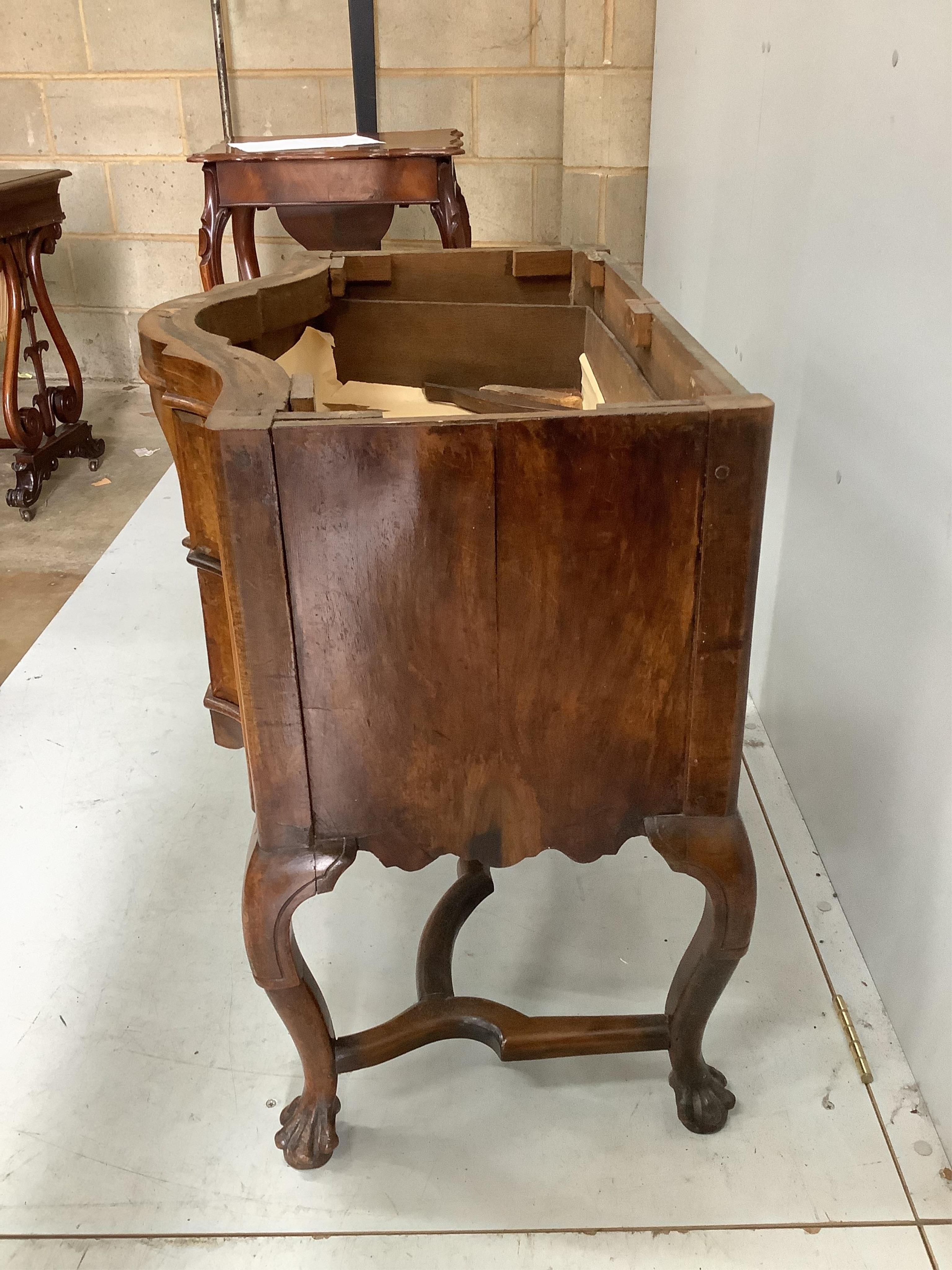 A 19th century Dutch serpentine walnut dressing table with associated triptych mirror, width 83cm. Condition - fair, some losses